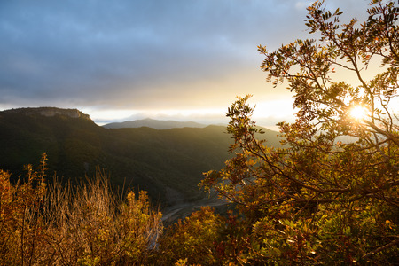 Colorful autumn landscape. Majestic sunset in the mountains. Dramatic sky. .Nature Background....
