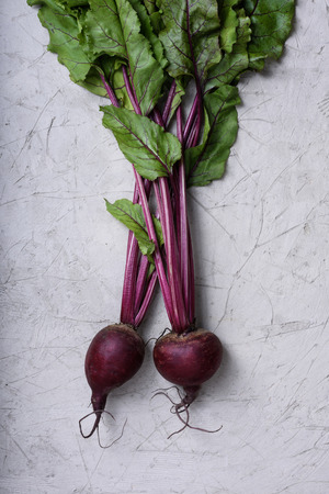 Fresh red beet with leaves. Autumn harvest, cooking ingredient. Above view.の写真素材