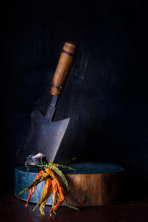 Seasoning, salt and pepper on wooden board. Cooking ingredients.の写真素材