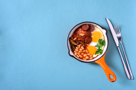 Traditional English Breakfast Food on the table eggs ,sausages, beans, View above, flat layの写真素材