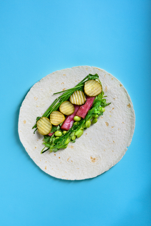 Tuna roll, hawaiian wrap with fish and edamame. Asian street food. Ready-to-eat, Healthy ingredients. Top view, flat lay.の写真素材