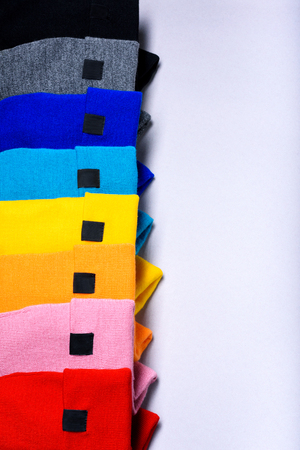 Colorful clothes items. Knitted beanie hats.Top view, copy space. Advertising discount mock up.の写真素材