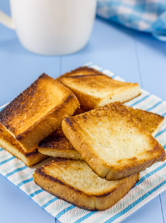 Breakfast toasts with a cup of coffeeの写真素材