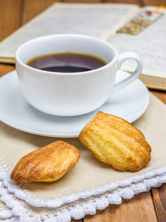Homemade madeleines with a cup of coffeeの写真素材