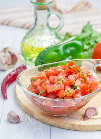 Bowl of fresh homemade salsa dip and ingredientsの写真素材