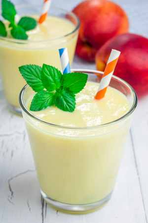Homemade peach, yogurt and honey smoothieの写真素材
