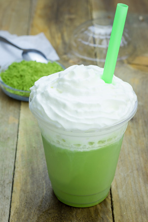 Homemade green tea frappe in plastic cupの写真素材