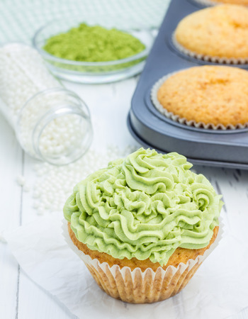 Healthy muffins with ricotta cheese and matcha frostingの写真素材