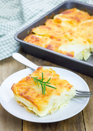 Potato gratin on a white plateの写真素材