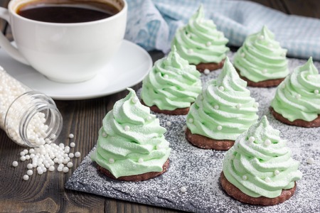 Homemade apple zefir fir-tree, placed on chocolate cookie and decorated with sugar ballsの写真素材