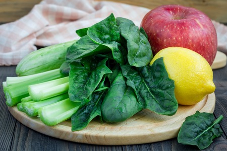 Ingredients for green smoothie with celery, cucumber, spinach, apple and lemonの写真素材