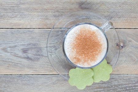Coffee latte in glass cups with matcha cookies, top view, copy spaceの写真素材