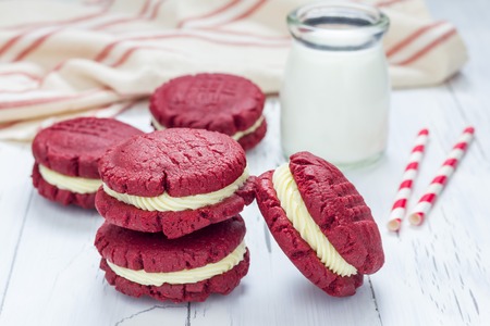 Red velvet sandwich cookies with cream cheese fillingの写真素材
