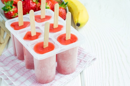 Homemade popsicles with strawberry and banana, copy spaceの写真素材