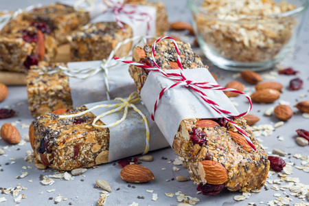 Homemade granola energy bars with figs, oatmeal, almond, dry cranberry, chia and sunflower seeds, healthy snackの写真素材