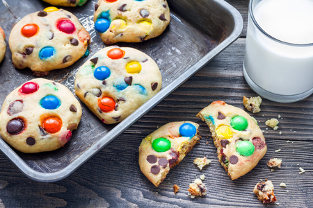 Shortbread cookies with multi-colored candy and chocolate chips on metal tray, horizontalの写真素材