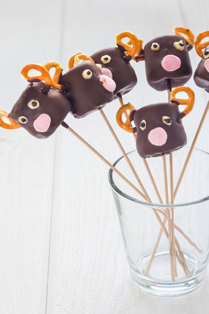 Christmas deers. Homemade sweetness made with marshmallow, chocolate and pretzelの写真素材