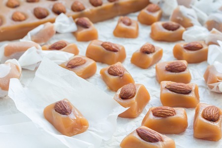 Homemade soft caramel candy with almonds, horizontalの写真素材