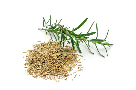 Dry rosemary tea and rosemary twig isolated on whiteの写真素材