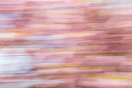 Abstract background image of cherry blossom flowers with a motion blur effect