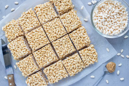 Making three ingredients bars with crispy rice, honey and peanut butter, horizontal, top viewの写真素材