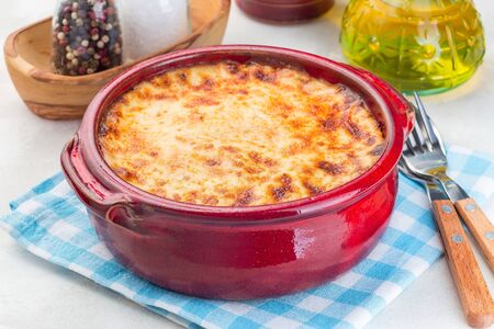 Greek dish moussaka made in a traditional ceramic pot, horizontalの写真素材