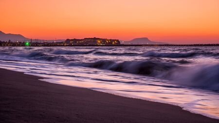 Sunset on the beach of Rethymnon city, Greece,  Creteの写真素材