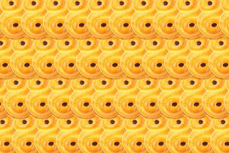 Food pattern background made from traditional Swedish and scandinavian Christmas saffron buns...