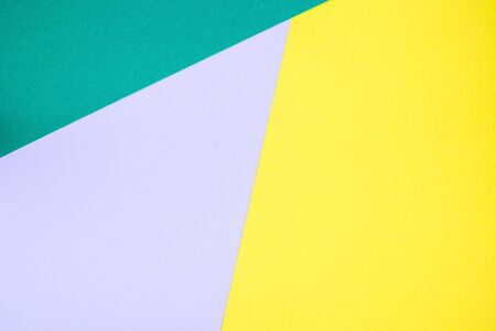 Geometrical pattern made from green, violet and yellow paper, blank background for template,  horizontal, copy spaceの写真素材