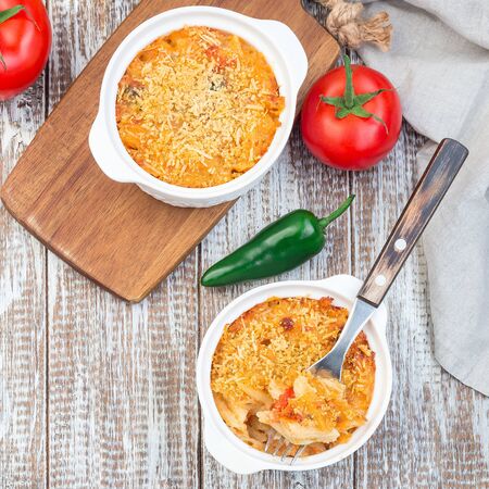 Mac and cheese with mini penne pasta, in a baking dish, top view, square formatの写真素材