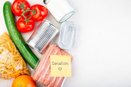 Food  for donation or delivery at home, note with a word donation, horizontal, top view, copy spaceの写真素材