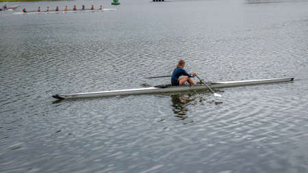 Woman sitting in kayak, paddling in the river water, horizontal, 10 september 2021, Cork, Ireland