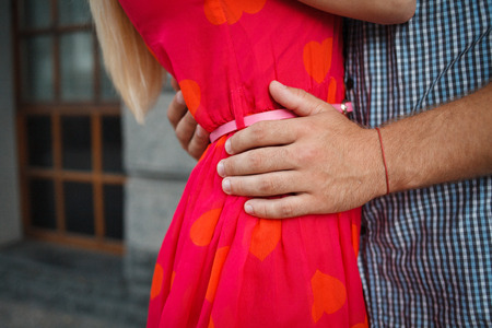Detail of holding hands of a loving coupleの写真素材