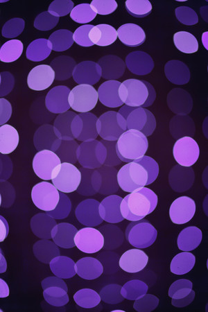 Violet Christmas background with lights out of focus. bokeh. defocusの写真素材