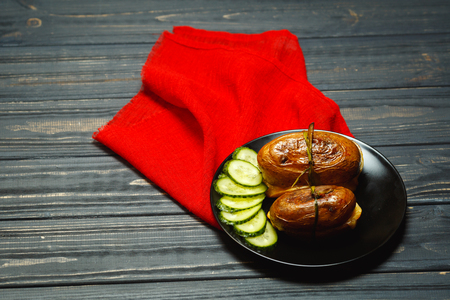 Delicious roast potatoes with garlic and cucumberの写真素材