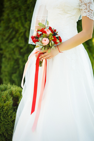 Sweet Wedding Bouquet in the Hands of the Brideの写真素材