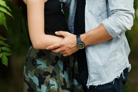 holidays, vacation, love and people concept - happy teenage couple walking in summer cityの写真素材