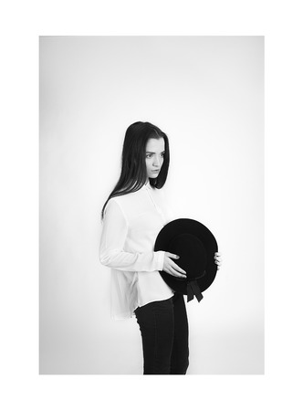 sweet hipster girl in black hatの写真素材