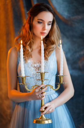 bride in gown with a candlesの写真素材