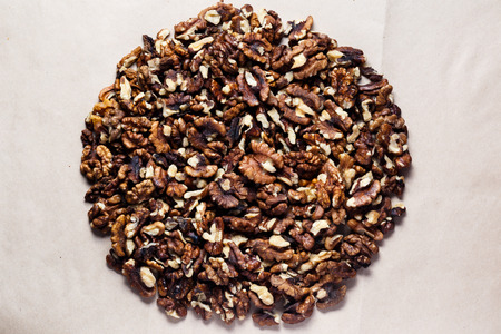 Walnut kernels walnuts on on kraft paper. Top view.
