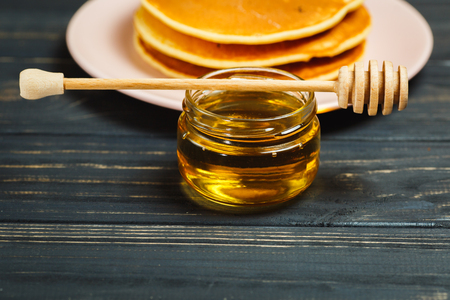 Tasty healthy breakfast - fresh pancakes with honeyの写真素材