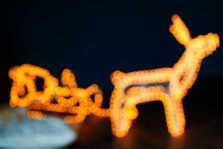 New Year glowing deer. Christmas reindeer sleigh lights effects.の写真素材