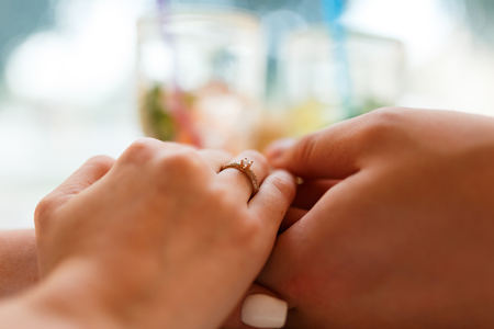 Boyfriend Surprised Her Girlfriend With Engagement Ring In Restaurantの写真素材