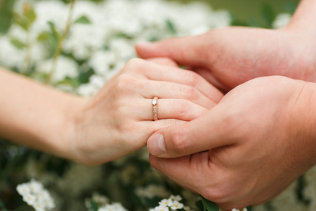 He gives his girlfriend an engagement ring in the botanical gardenの写真素材