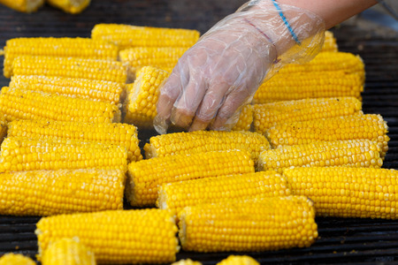 Cooking corn on the grillの写真素材