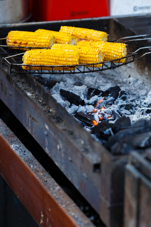 Cooking corn on the grillの写真素材
