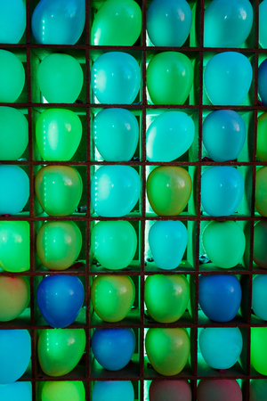 Many colorful balloons decorated wall as backgroundの写真素材