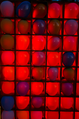 Many colorful balloons decorated wall as backgroundの写真素材