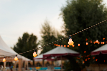 warm light bulbs at the evening eventの写真素材