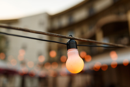warm light bulbs at the evening eventの写真素材
